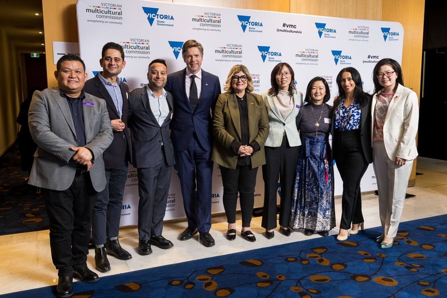 Photo of VIPs at the VMC media wall