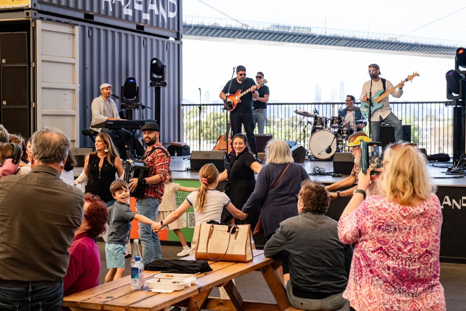 Band playing at Grazeland with people dancing